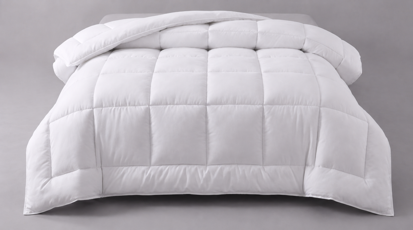 Premium 13.5 Tog Hotel Quality Microfibre Duvet with box-stitch construction, shown as voluminous, deeply plump, billowy cloud-like folds on a soft grey backdrop.